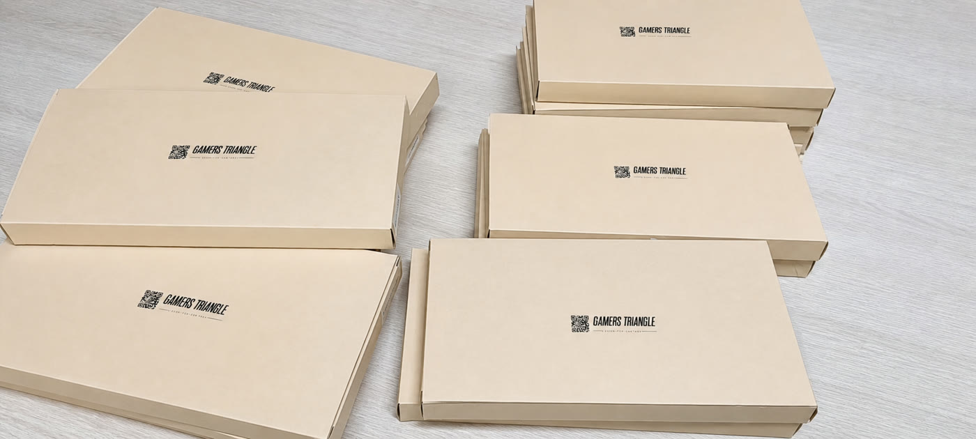Batch of kraft boxes printed with Gamers Triangle branding